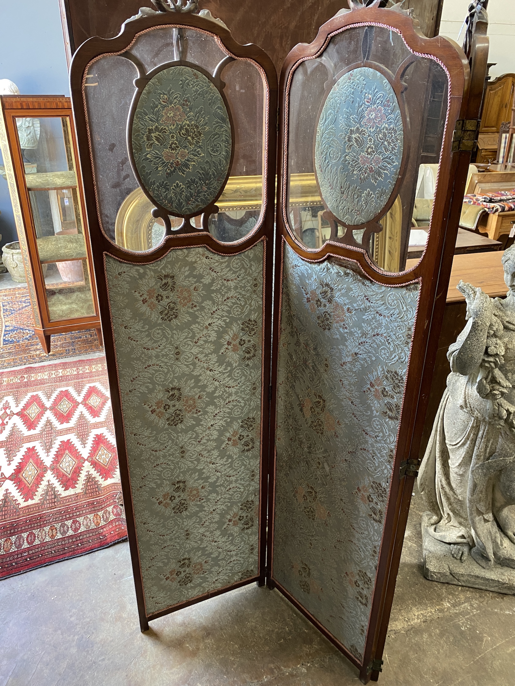 An Edwardian inlaid glazed mahogany three fold dressing screen, each panel width 45cm, height 186cm